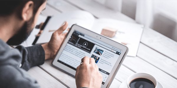 CarsonMX_Man-Working-on-Tablet