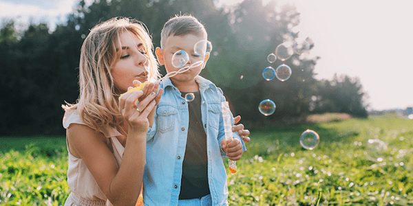 CarsonMX_Mother-and-Son-Blowing-Bubbles