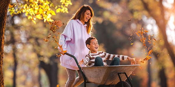 CarsonMX_Mother-and-Son-Playing-in-Leaves