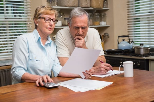 couple-with-bills