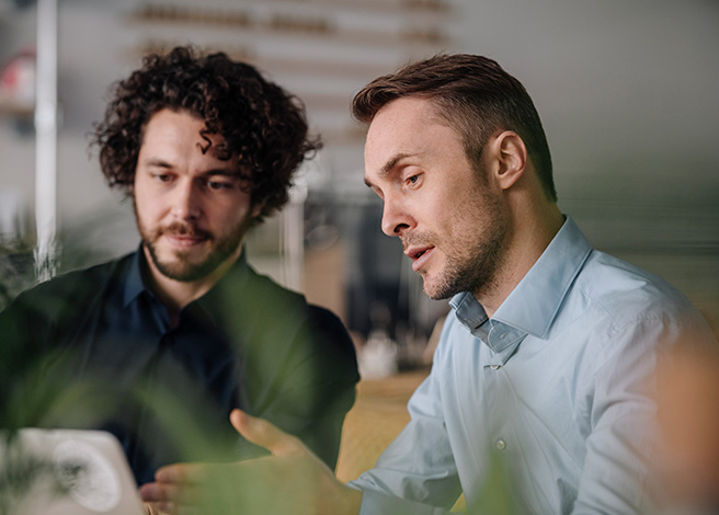 Two businessmen having a meeting in a coffee shop